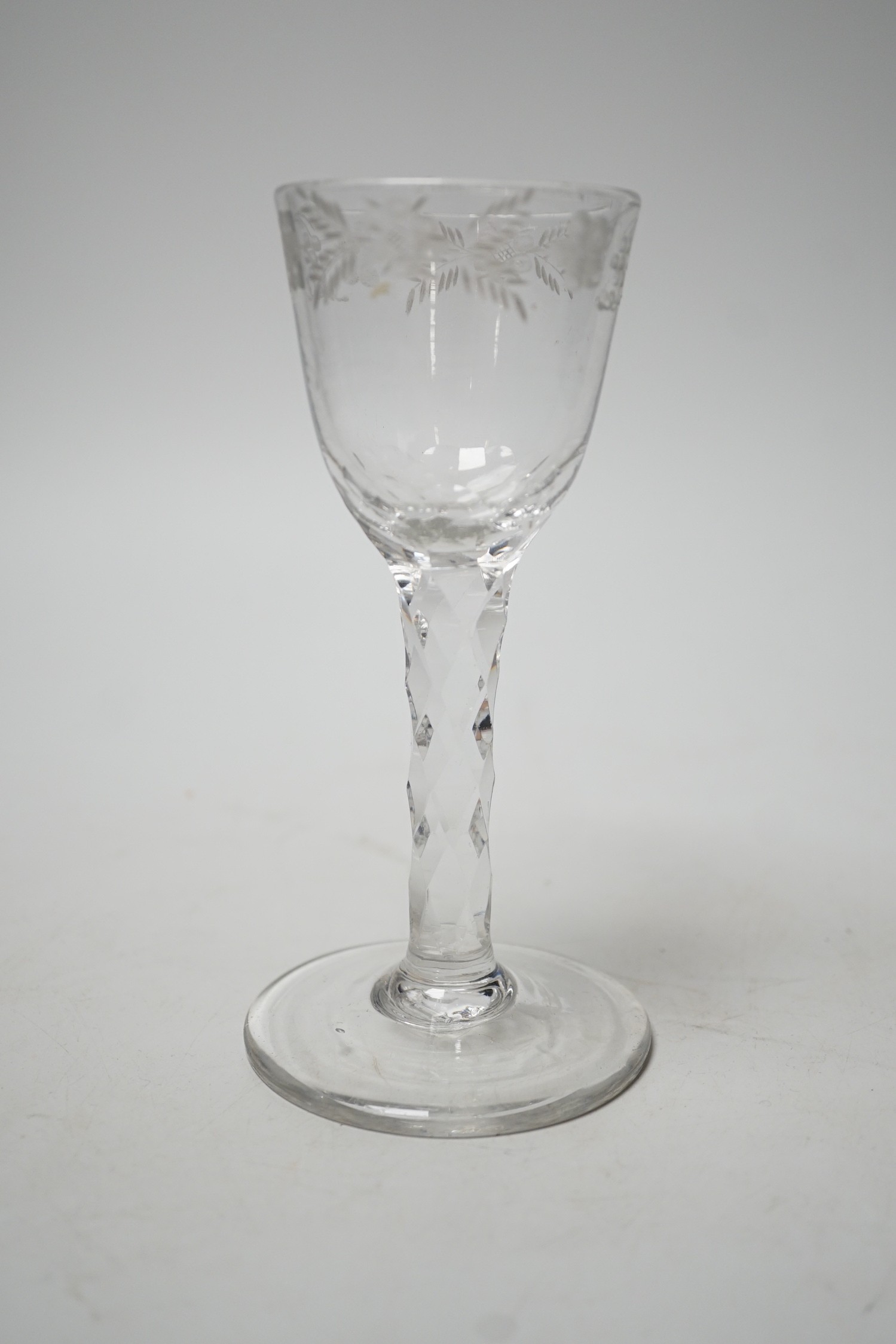 A George III facet stem wine glass. 15.5cm tall